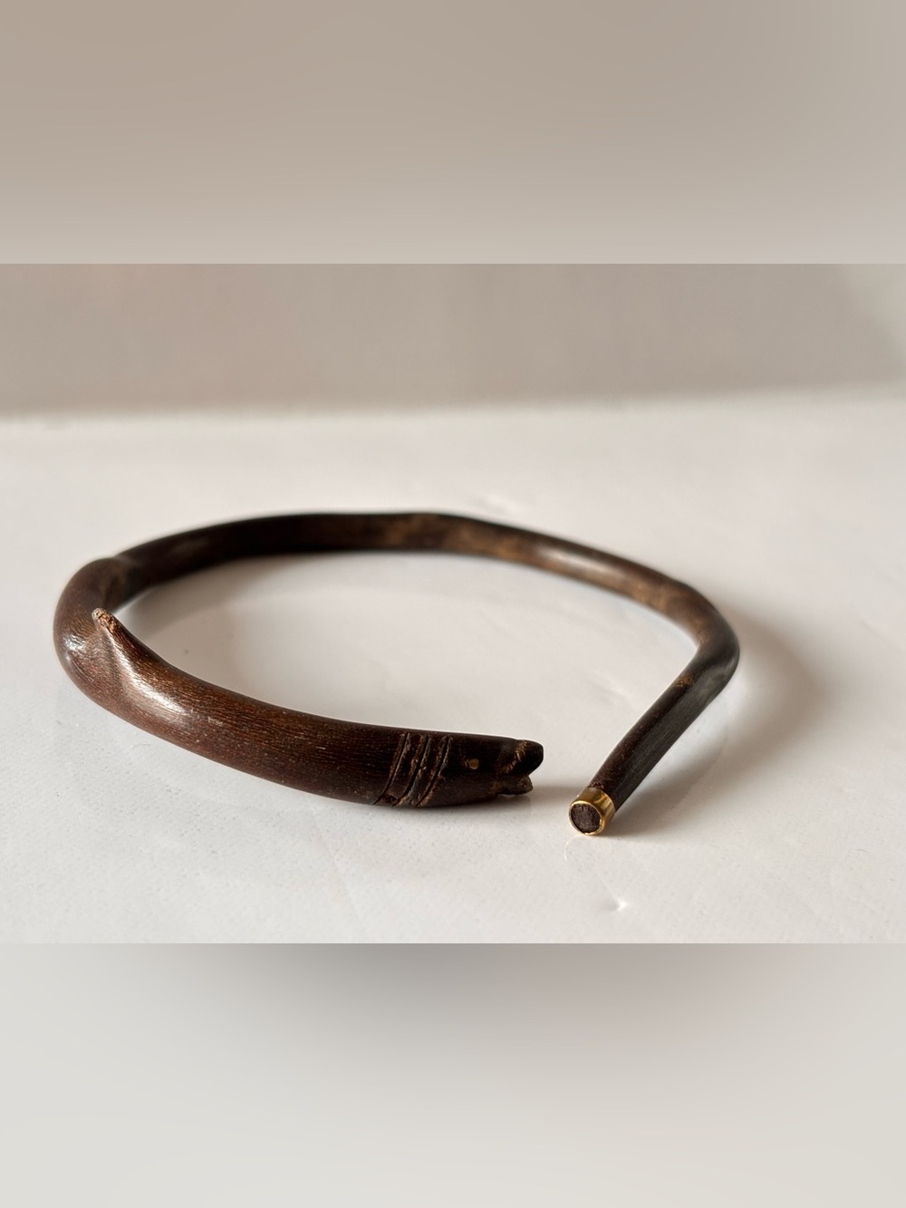 Vintage wooden fish carved with brass bracelet